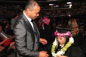 Carlos Flores and his daughter Asia Flores at the 2016 FIDM Graduation at the Staples Center in LA on June 20, 2016. Photo by Lia Chang